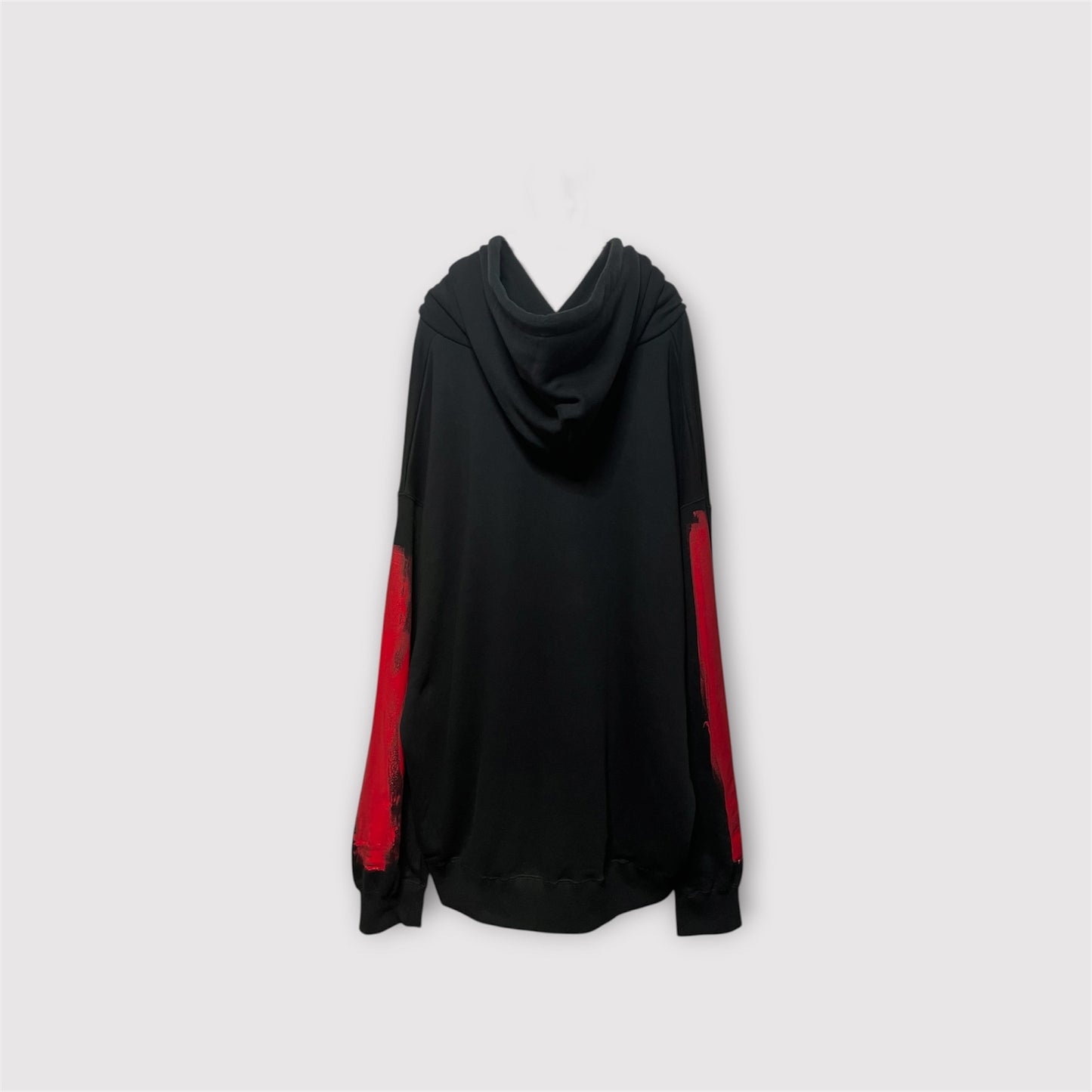 Aggressive paint extra over hoodie